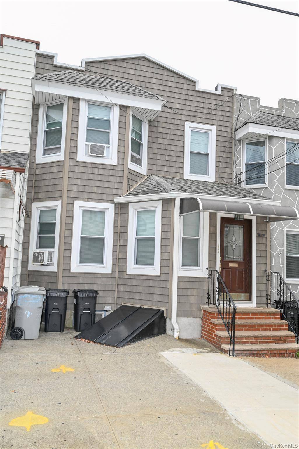 Charming to family with garage in Maspeth this legal two family home features a three bedroom unit over a two bedroom unit offering versatility for a living or renting income.
