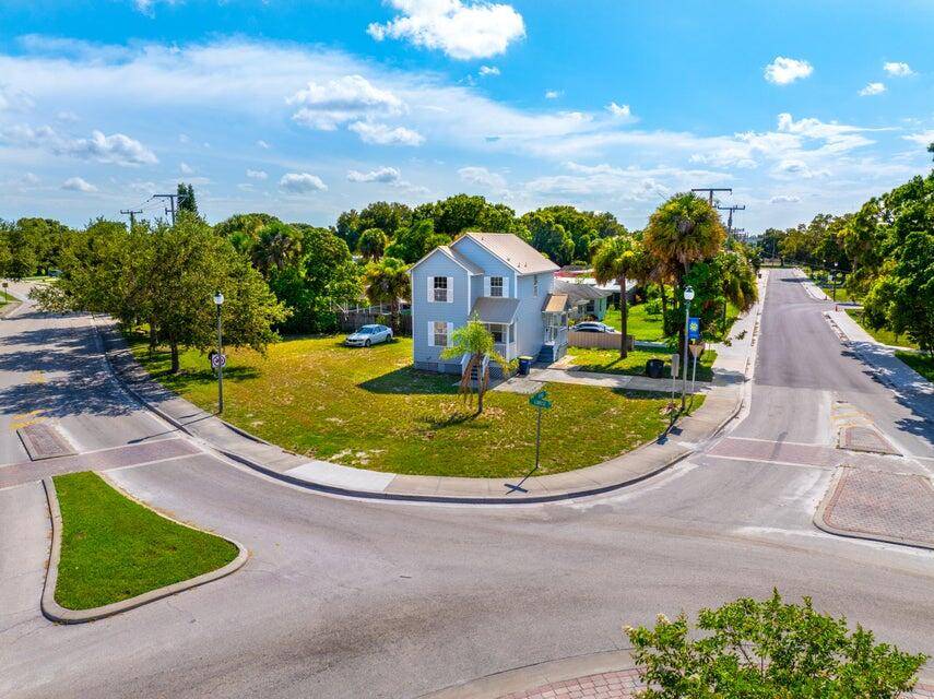 Discover this beautifully renovated two story home, perfectly situated on a spacious corner lot in the vibrant heart of Fort Pierce.
