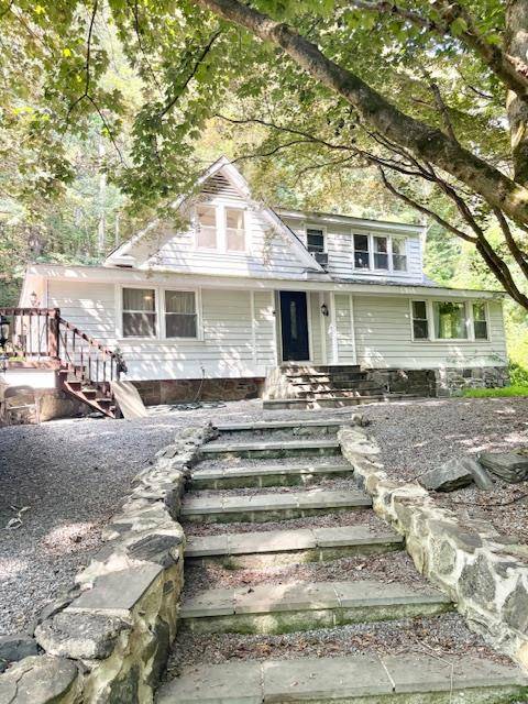 Tucked away on a private road in desirable Katonah, this 1935 Colonial is a true hidden gem.