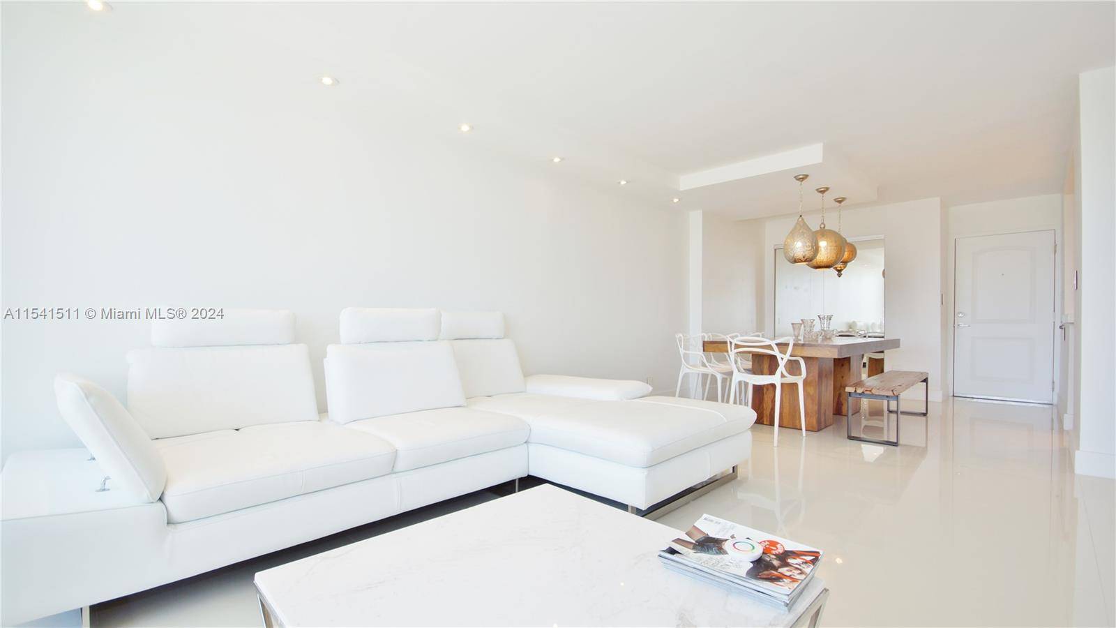 Contemporary and elegantly renovated, this fully furnished condo in Arlen House East offers a delightful retreat just steps away from the beach.