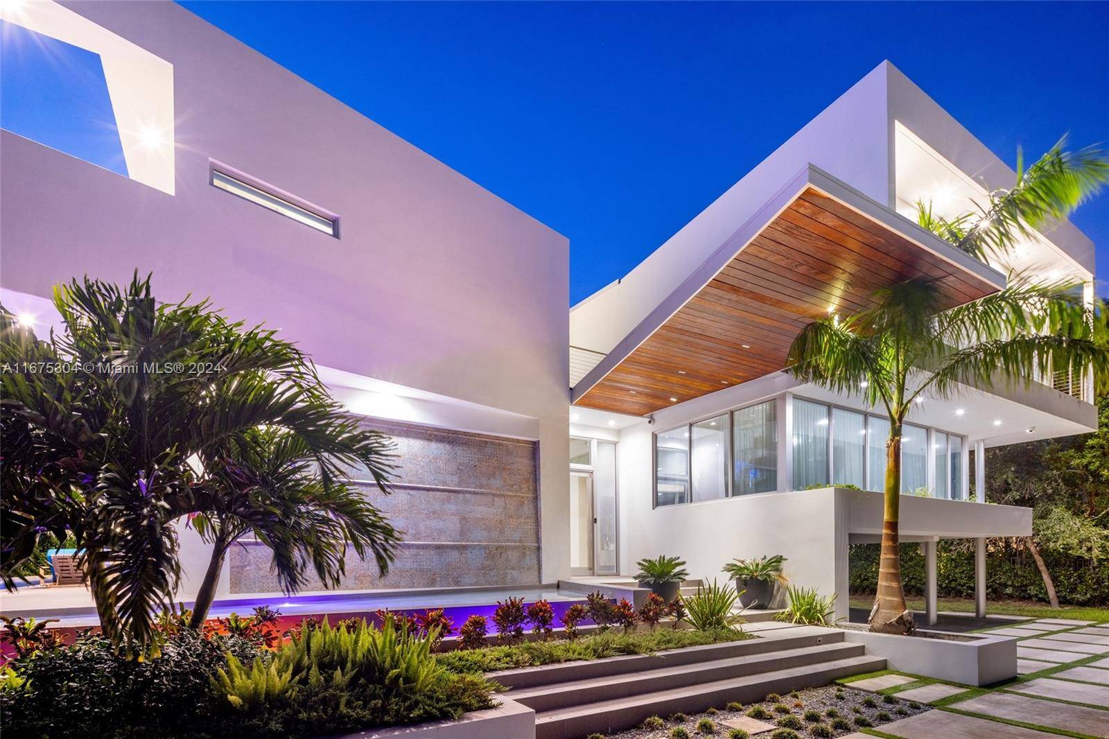 Indulge in the epitome of luxury living with this stunning modern masterpiece on an expansive corner lot in guard gated Hibiscus Island.