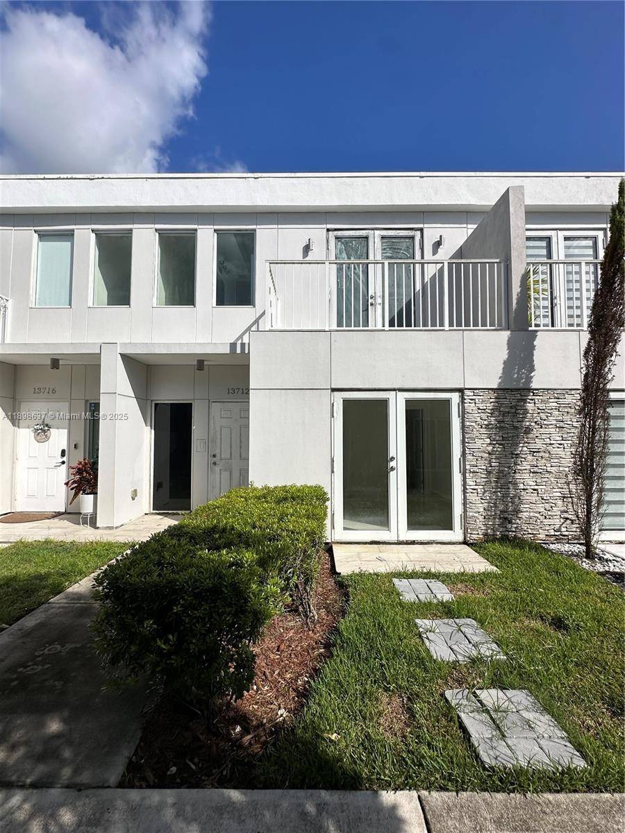 Beautiful and spacious townhouse with high ceilings, impact windows, and a modern open concept kitchen.