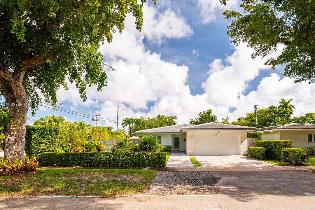 Stunning 1, 900 sq. ft move in ready home situated on corner of beautiful tree lined street in Coral gables.