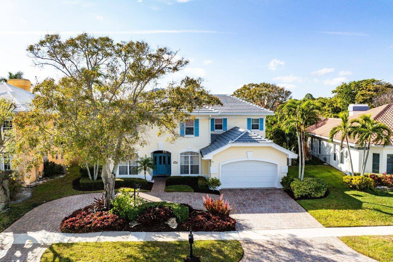 Luxurious turnkey estate home with high quality furnishings in the prestigious gated community of Crystal Pointe, Palm Beach Gardens.