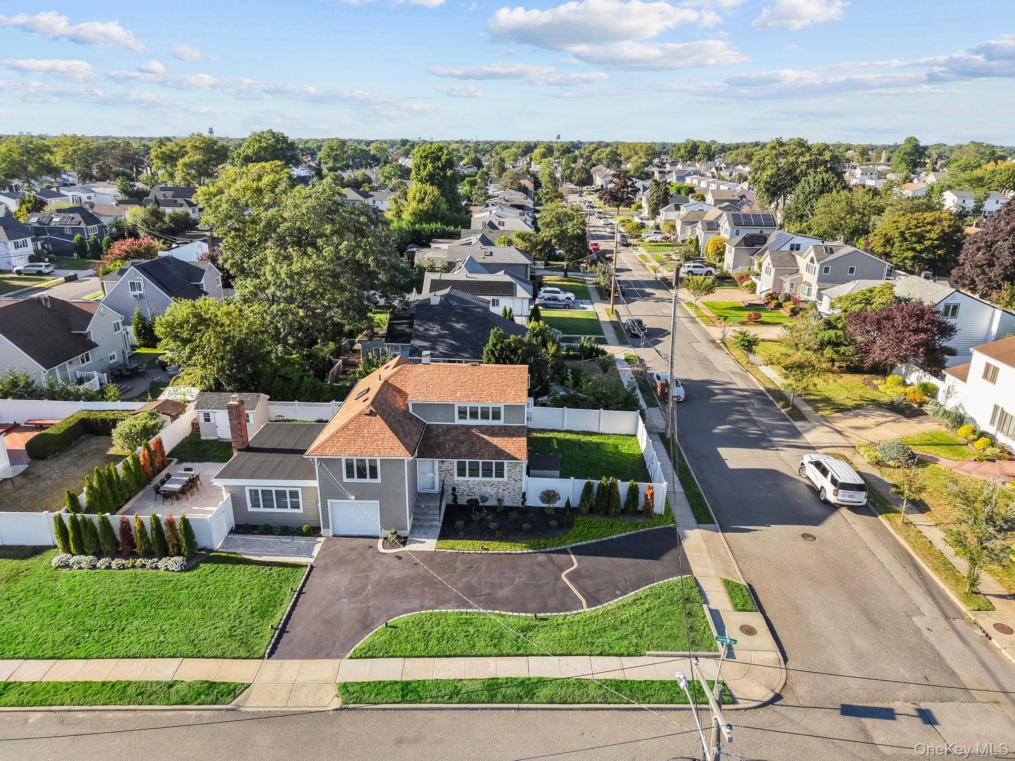 Prime South Merrick Location This Expanded Split Level Home Sits On An Oversized Corner Lot And Offers 3 Spacious Bedrooms And 2 Full Bathrooms.