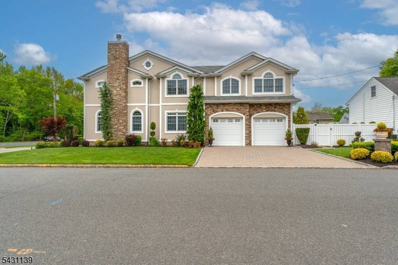 This newly renovated Colonial home filled with character commands attention on a corner lot where meticulously manicured landscaping and a sweeping paver driveway create undeniable curb appeal.