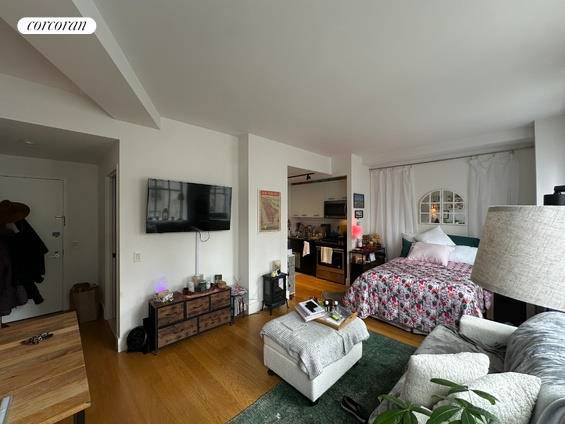 Amazing short term furnished Studio apartment featuring a renovated kitchen beautifully outfitted with custom cabinets and stainless steel appliances.
