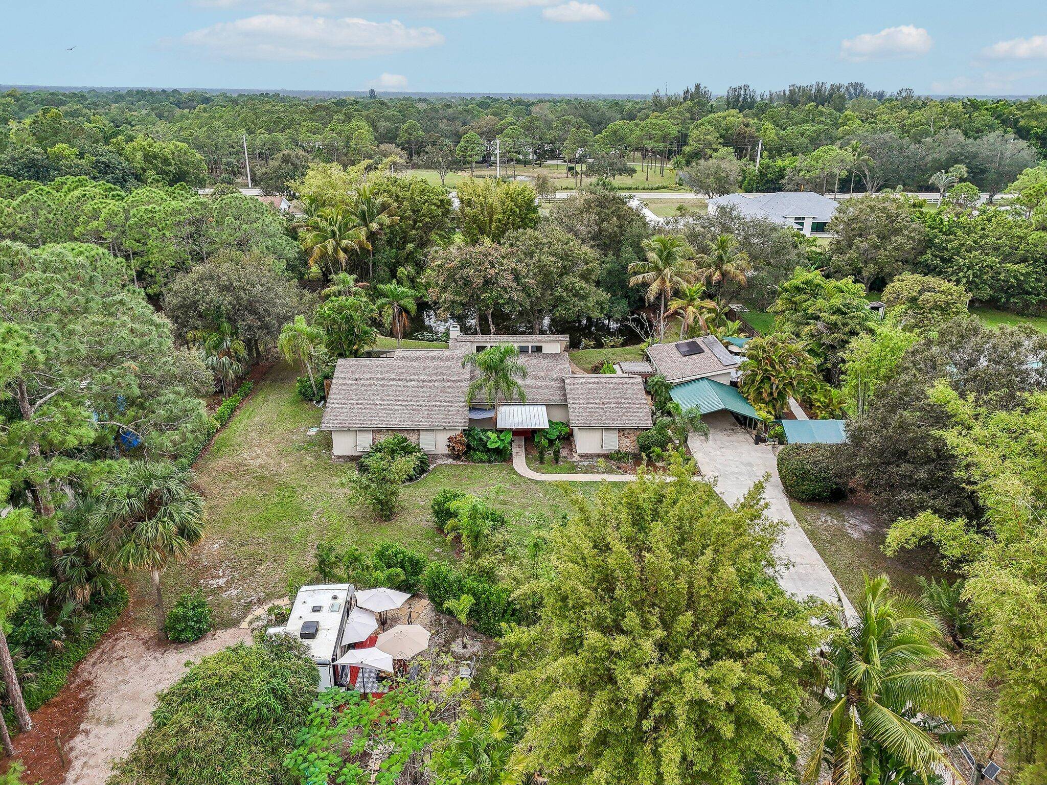Stunning 3 bed, 3 bath home on over an acre in Jupiter Farms no HOA.