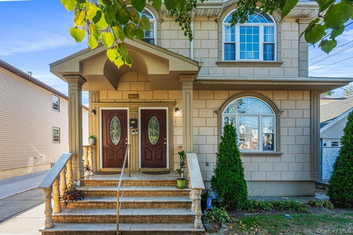 Freshly Painted, Refinished hardwood floors and Newer windows highlight this immaculate 2 family with finished walk out basement.