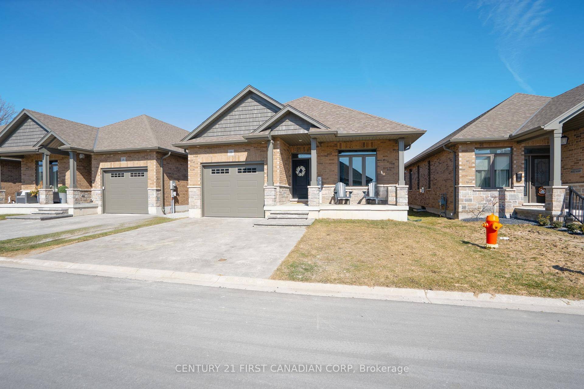 Welcome to Unit 19 at 159 Collins Way, where modern elegance meets effortless living in the desirable town of Strathroy.