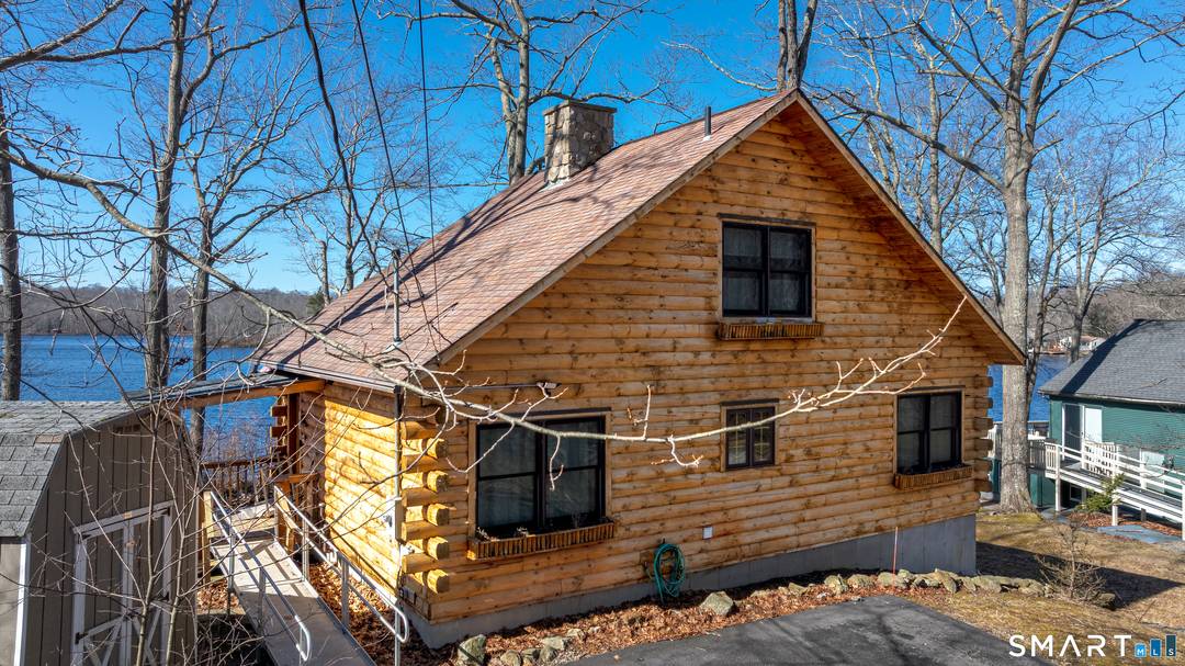 Lake Williams private lakeside retreat, where rustic charm meets breathtaking waterfront living in this beautifully crafted log cabin set directly on the lake.