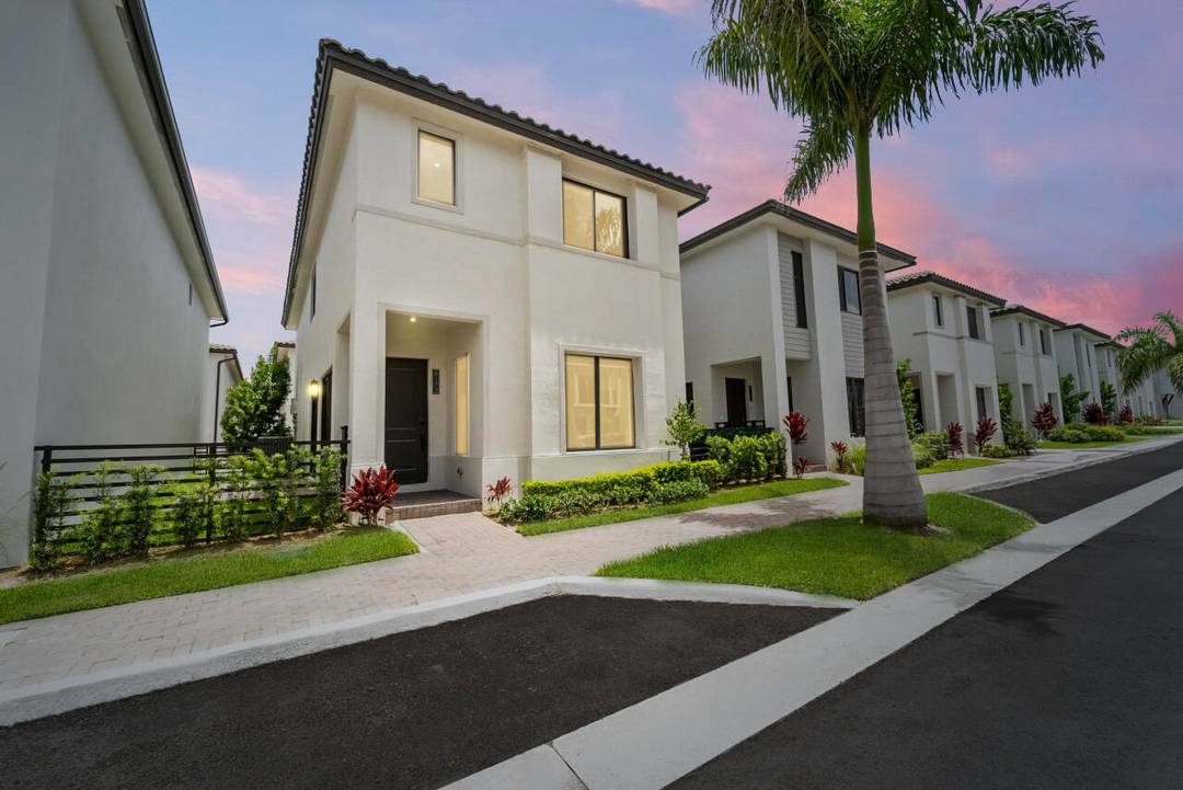 Experience contemporary living in this beautiful 2 story home in Downtown Doral Canarias.