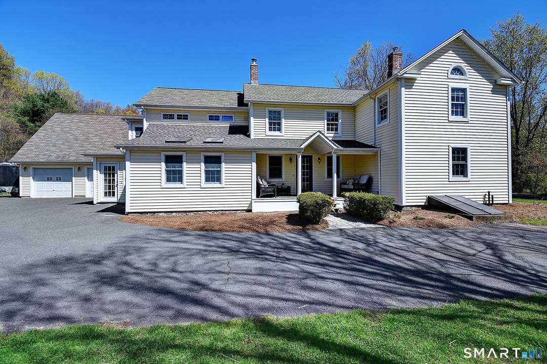 Set on 2 serene acres in the heart of Granby, directly across from the breathtaking trails of the McLean Game Refuge, this extraordinary circa 1825 Colonial is where timeless New ...