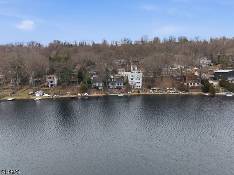 Welcome to 92 Cedar Lake West, a stunning three bedroom, two bathroom lakefront home with spectacular water views and the best of lake living right from your own backyard.