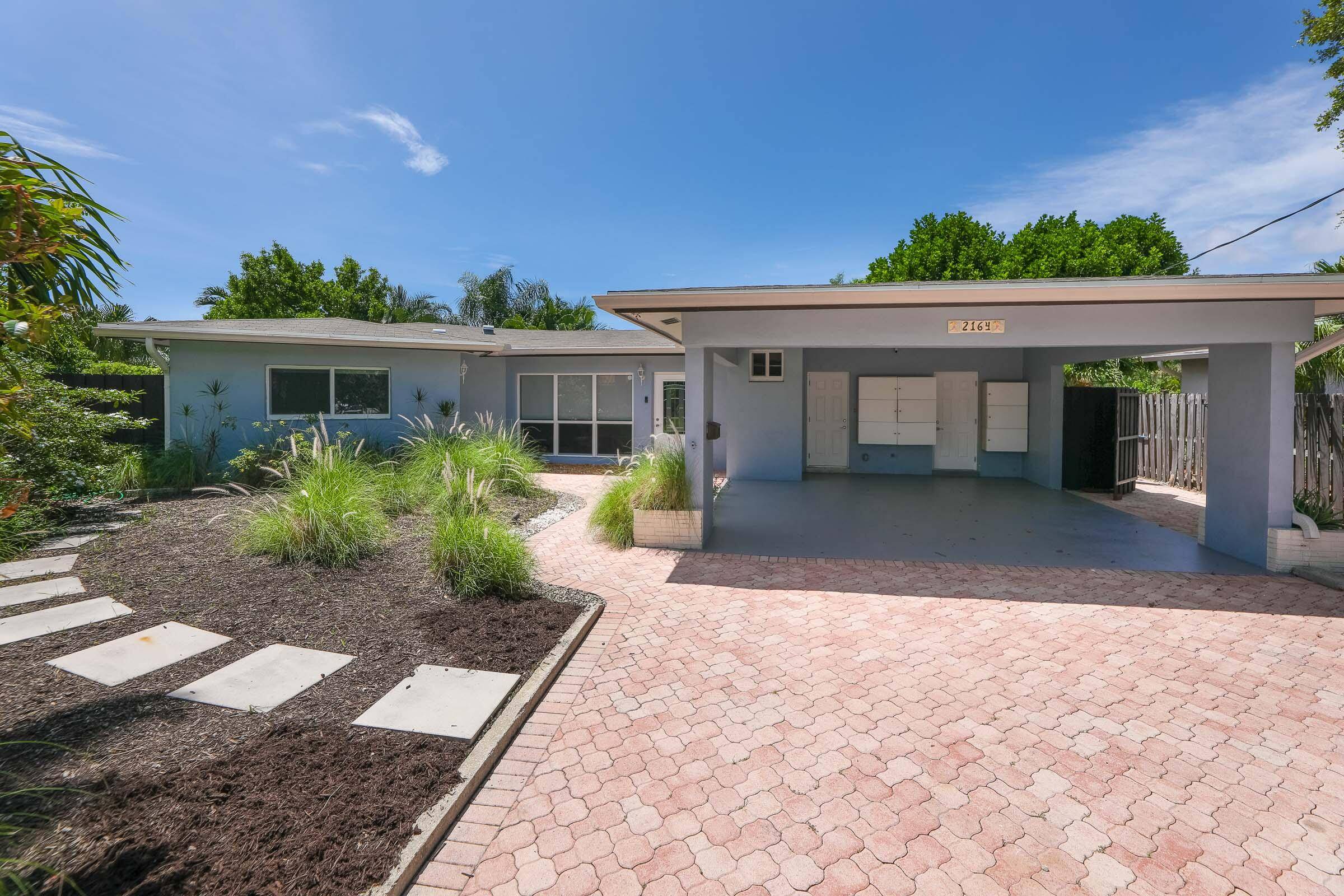 True Rare Florida Charmer with Incredible Waterfront Views and oversized salt water pool.