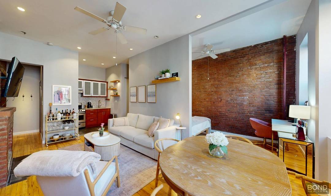 Its one flight up to these expansive living quarters defined by lofty 10 foot ceilings, recessed lighting, and oversized parlor floor windows that bathe the home in natural light.