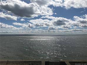 Travel through a gated entrance along a majestic tree lined drive to arrive at a stunning elevated parcel with 227 feet of direct Long Island Sound frontage.