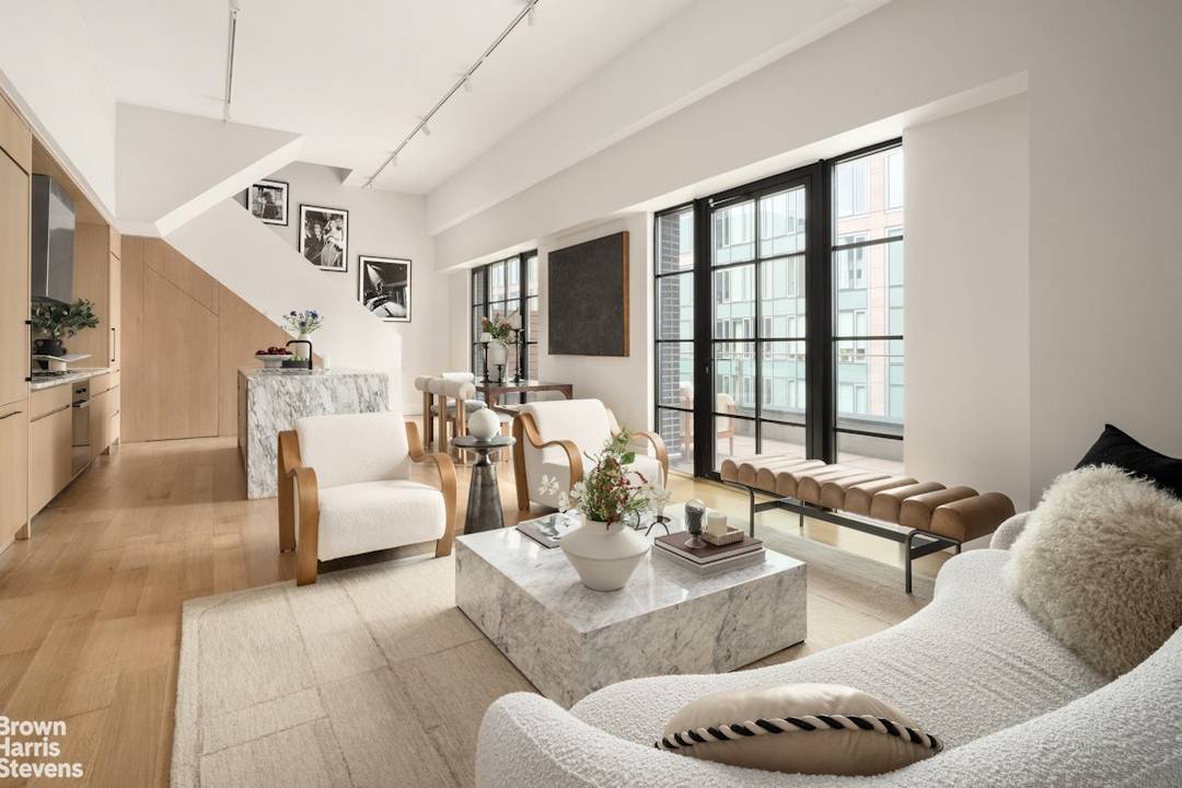 The Penthouse at 517 West 29th Street offers a rare combination of scale, design, and outdoor living, unfolding across a beautifully composed two bedroom, two bathroom duplex.