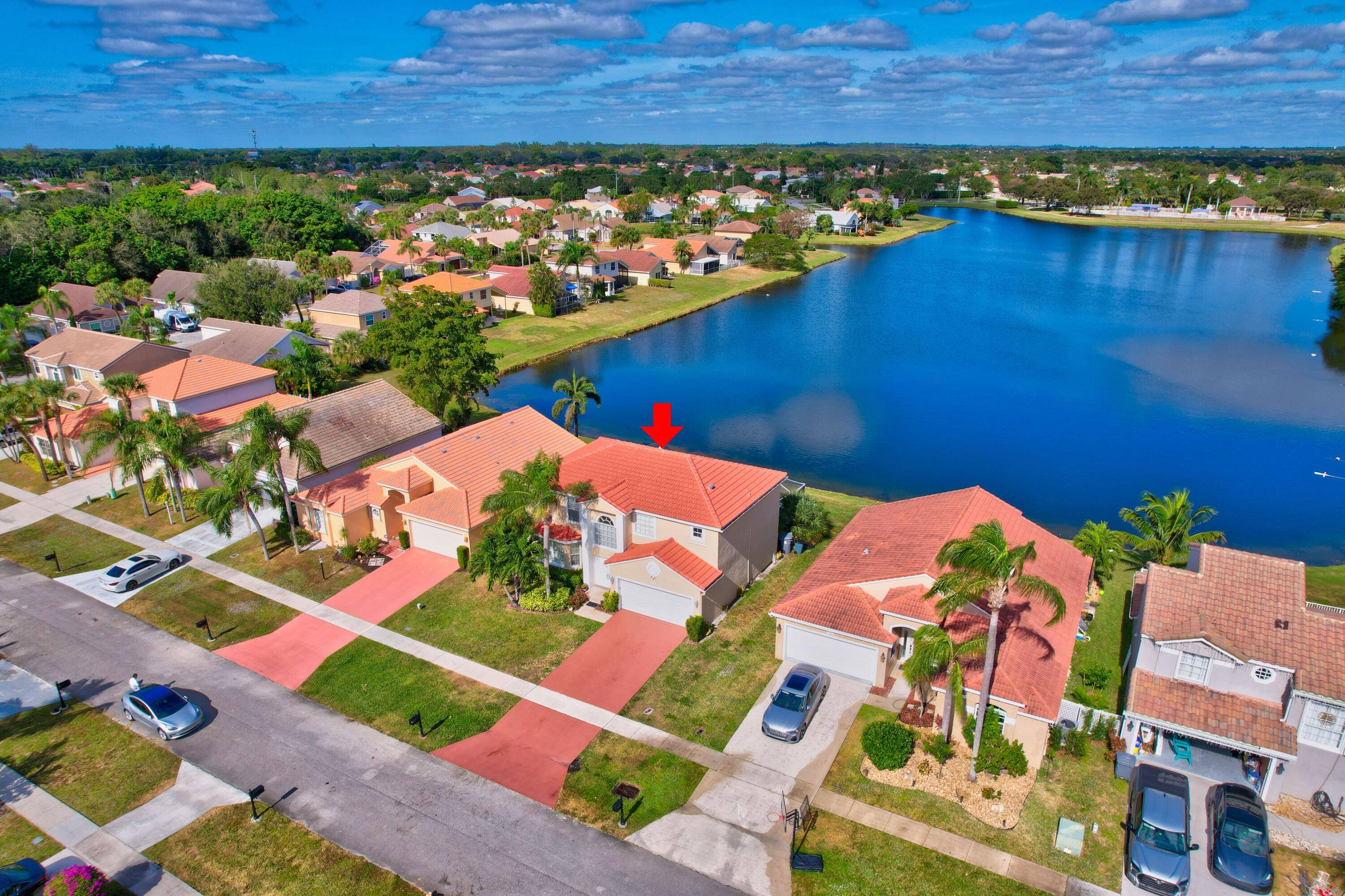 4 Bedroom 2 1 2 bath with a large screened in pool and an Expansive Lake View !
