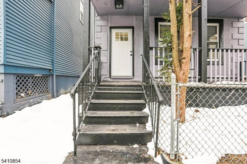 Cozy 2 family home on a generous 50x100' lot with oversized detached 2 car garage.