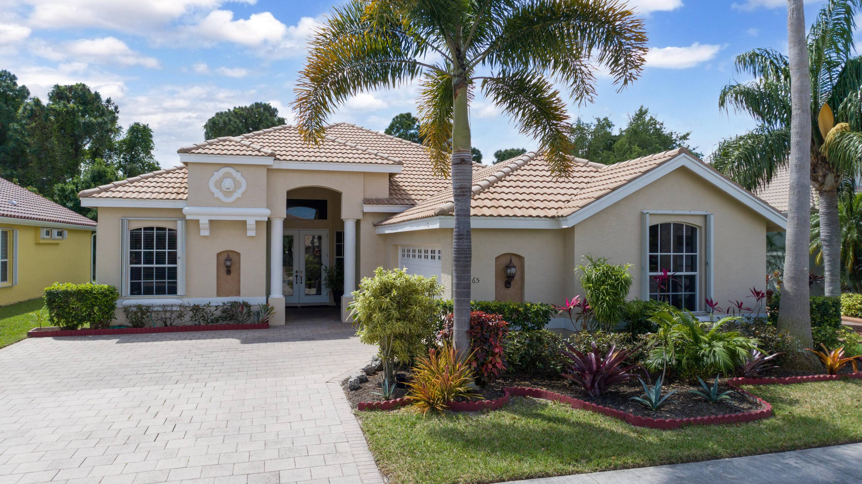 This beautiful home is located in the desirable gated community of Lake Charles in Port St Lucie.