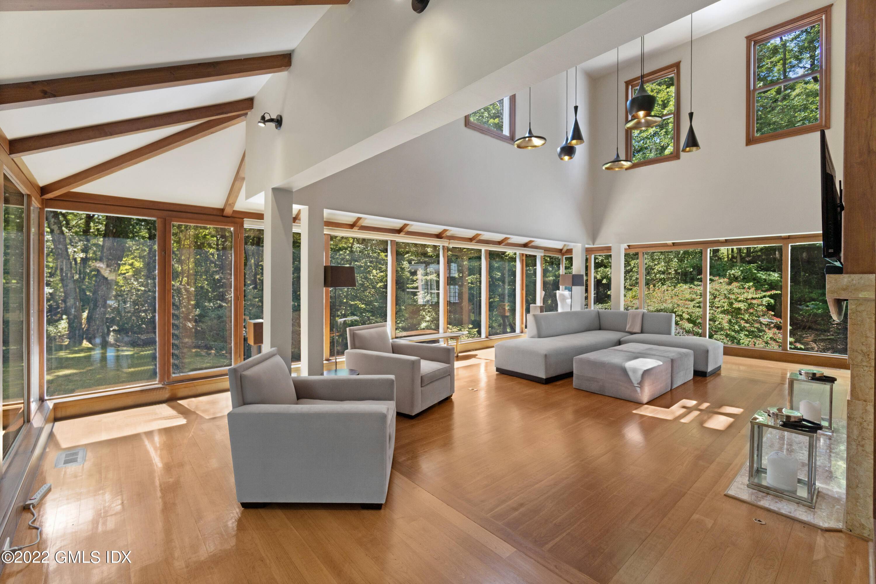 Secluded on 2. 26 sylvan acres, this recently renovated contemporary offers airy and bright spaces with high ceilings and comfortably sized rooms.