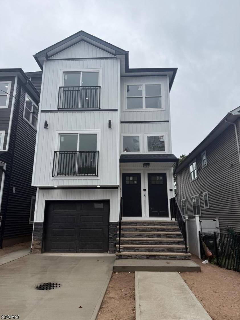 Brand new construction two family home featuring modern finishes and thoughtful design.