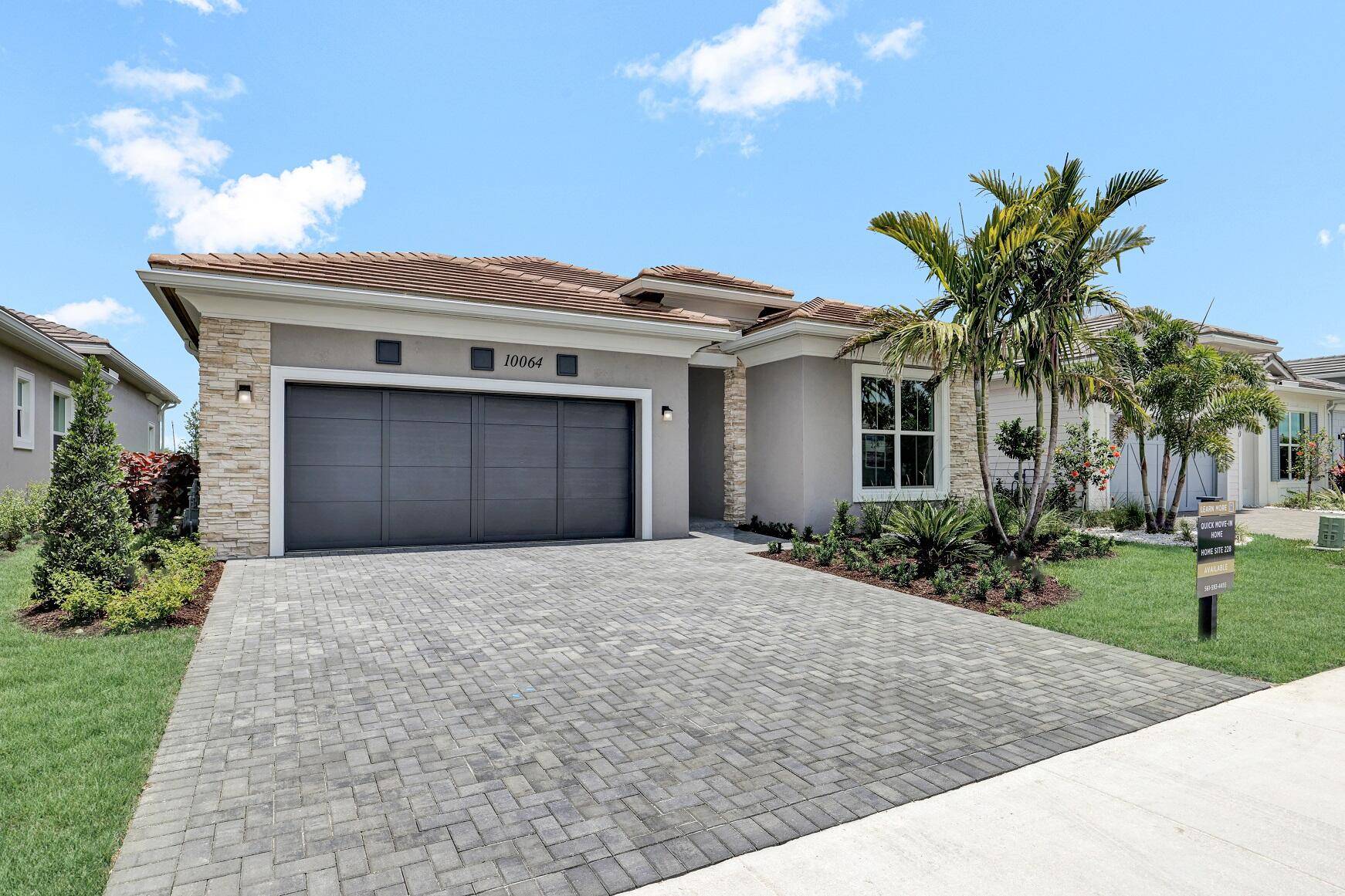 This McKenna home is stunning, boasting a striking Contemporary elevation with sophisticated veneer stone exterior that sets the tone for elegance.