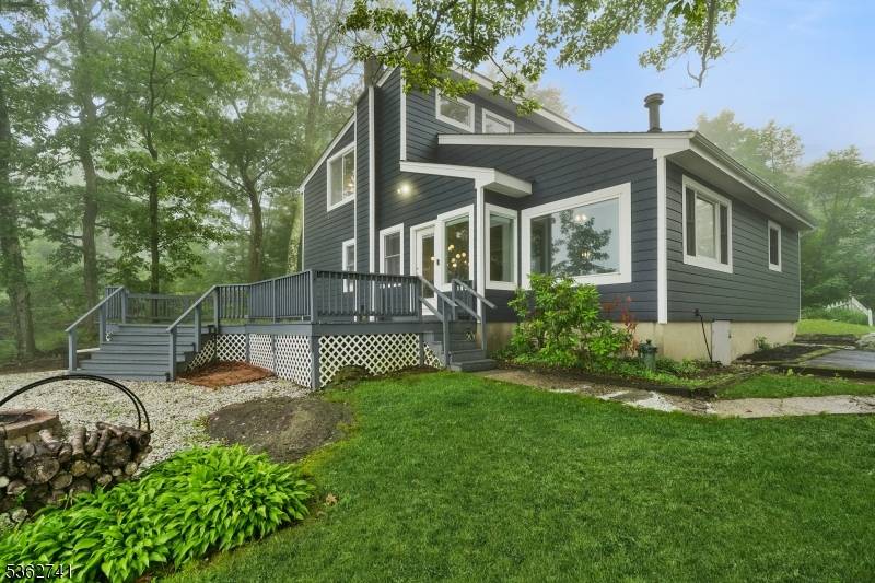 Contemporary lakefront living with unmatched views this home is sitting pretty perched high above Upper Greenwood Lake, where breathtaking panoramic views privacy await.
