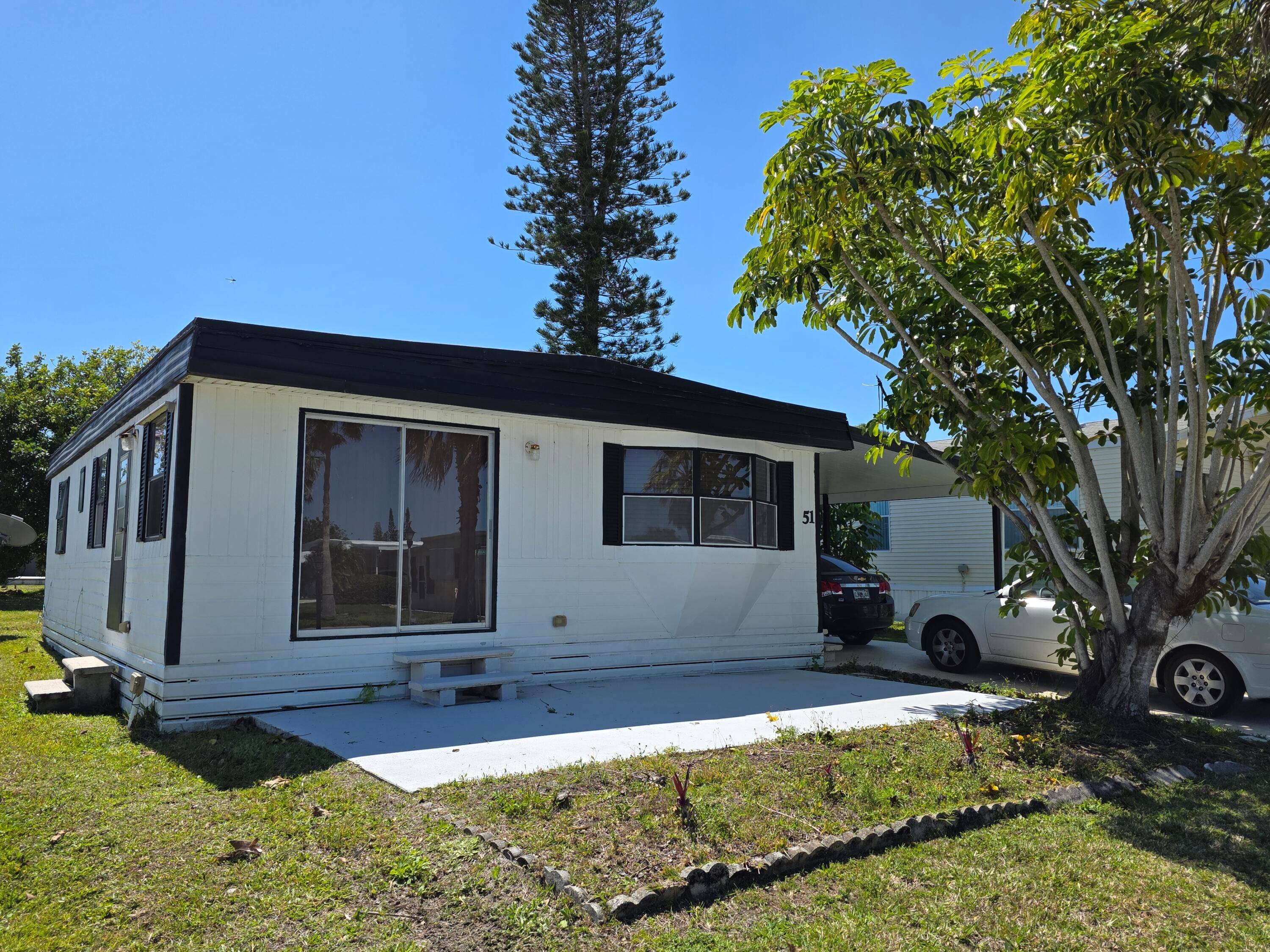 This 2 bed, 2 bath is a handyman special and nestled in a quiet 55 community on the water !