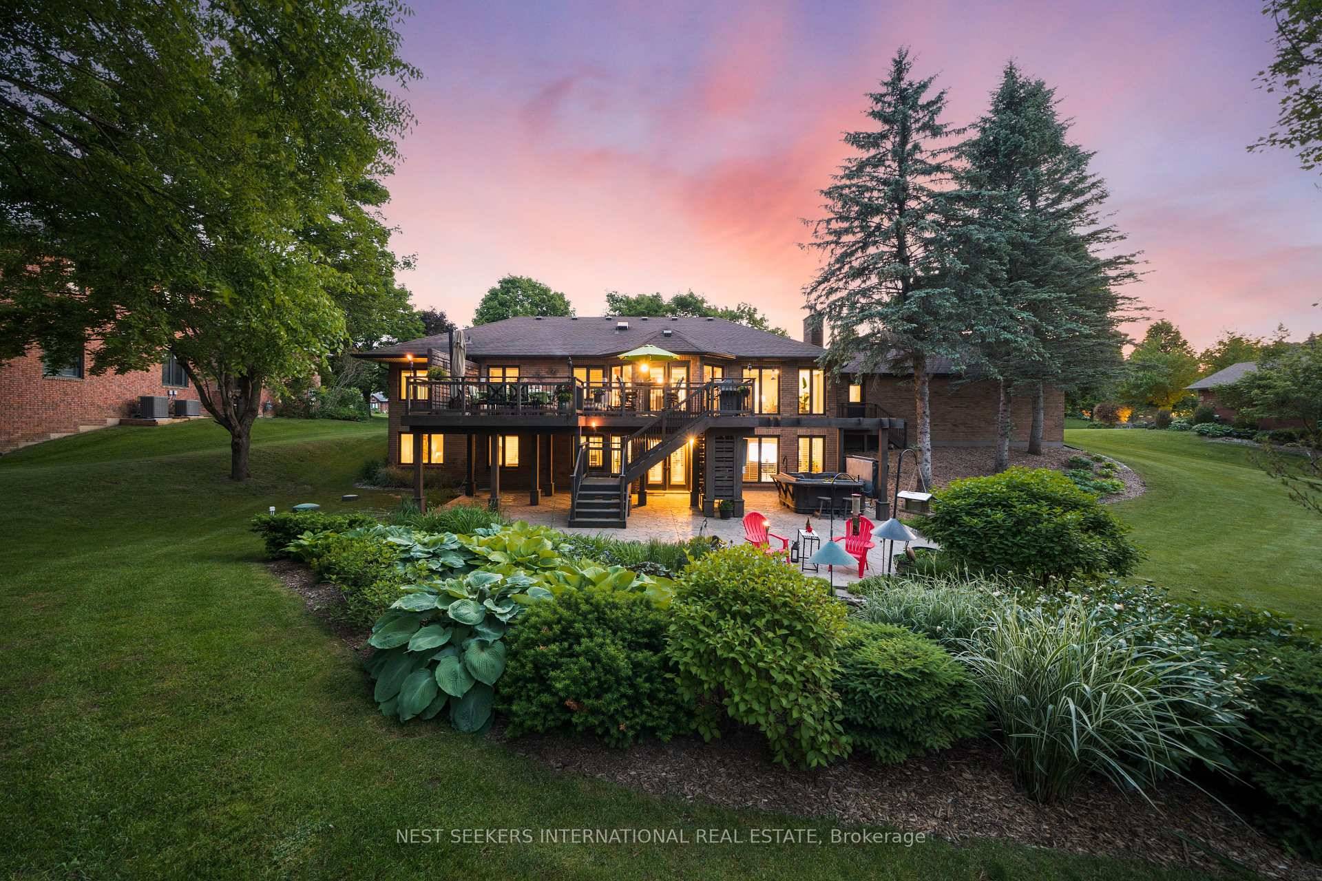 Tucked away on a breathtaking one acre ravine estate lot backing onto the East Humber River, this custom built ranch style walk out bungalow offers over 6, 300 sq.