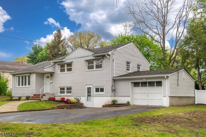 Welcome to this bright and updated split level home featuring 3 bedrooms and 1.