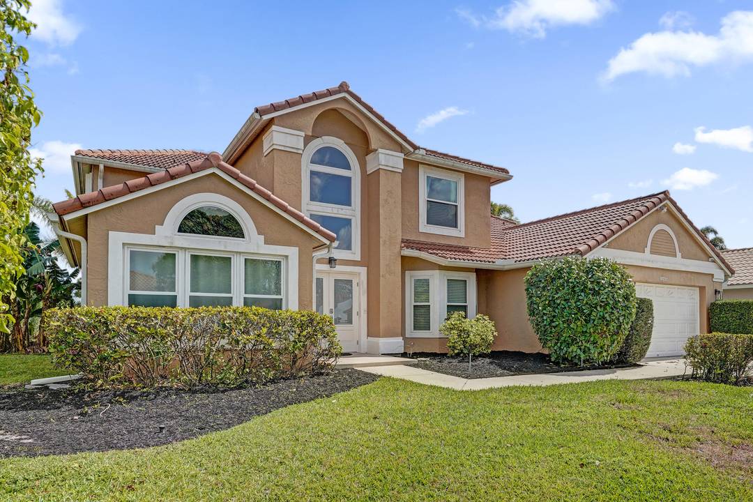 Spacious 5 bedroom office lakefront pool home in the sought after Harbour Lakes at Lakes of Boca Raton.