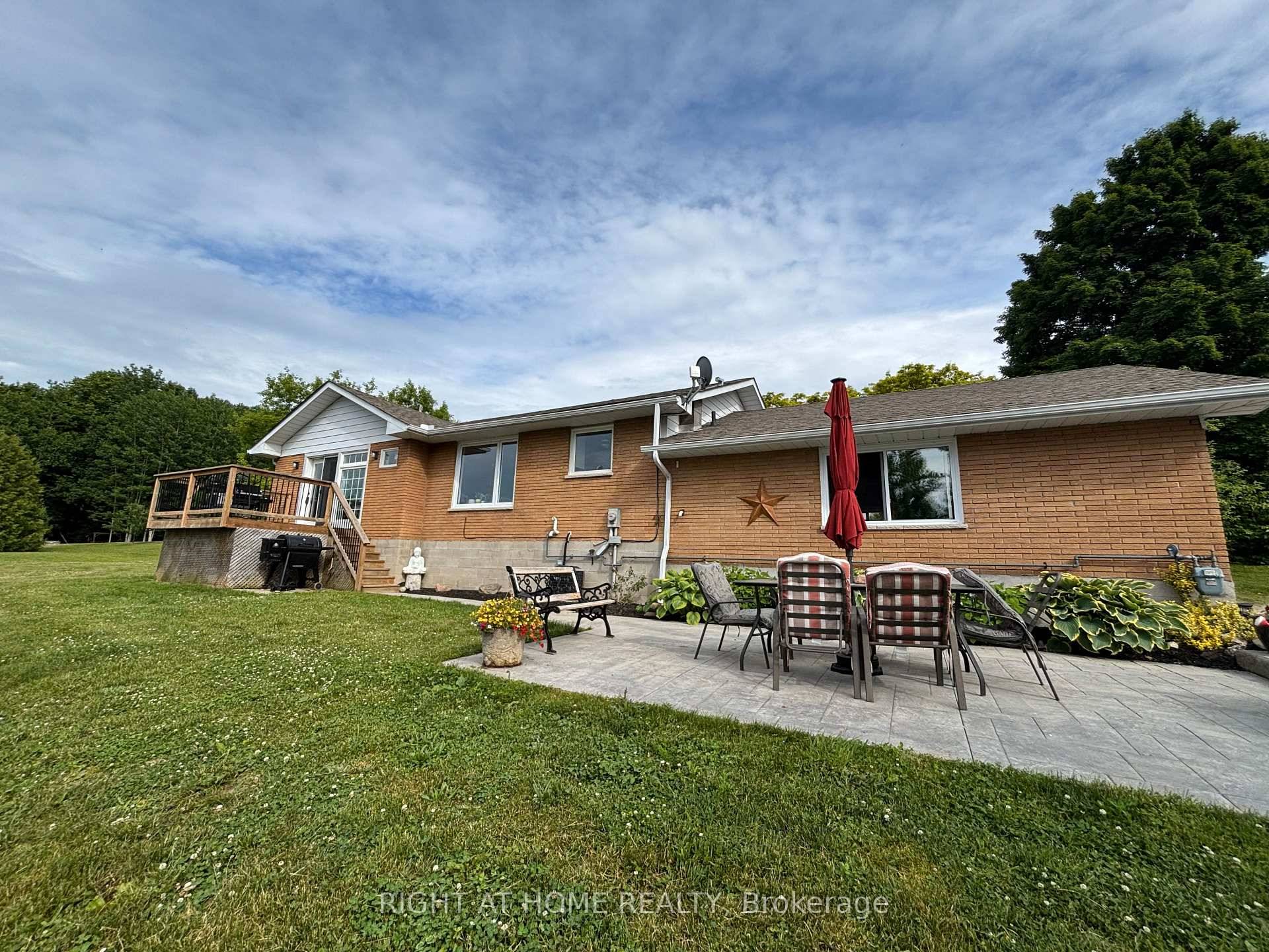 Beautiful 3. 15 Acre lot with gorgeous views, gardens and new stamped concrete patio.