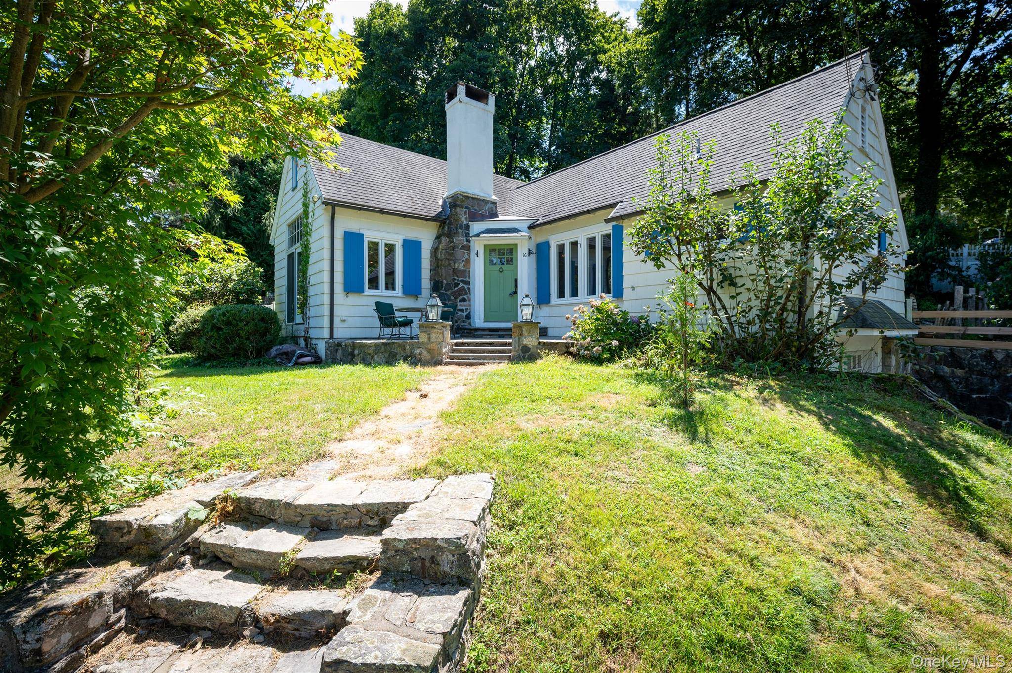 This charming cottage offers classic period architecture and serene views of Lake Truesdale.