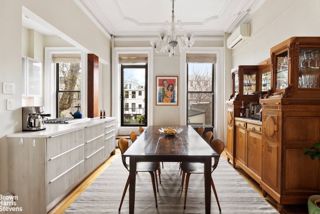 Stylishly Renovated Townhouse with Garage Tucked behind a beautifully restored facade on a quiet, tree lined block, 185 12th Street is a masterclass in thoughtful renovation and timeless design.