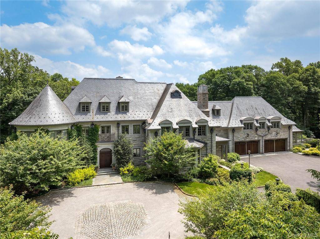 This spectacular limestone French Manor estate sits on 10 acres on Converse Lake with 100' of lakefront in exclusive Conyers Farm, a guard gated community with private security.