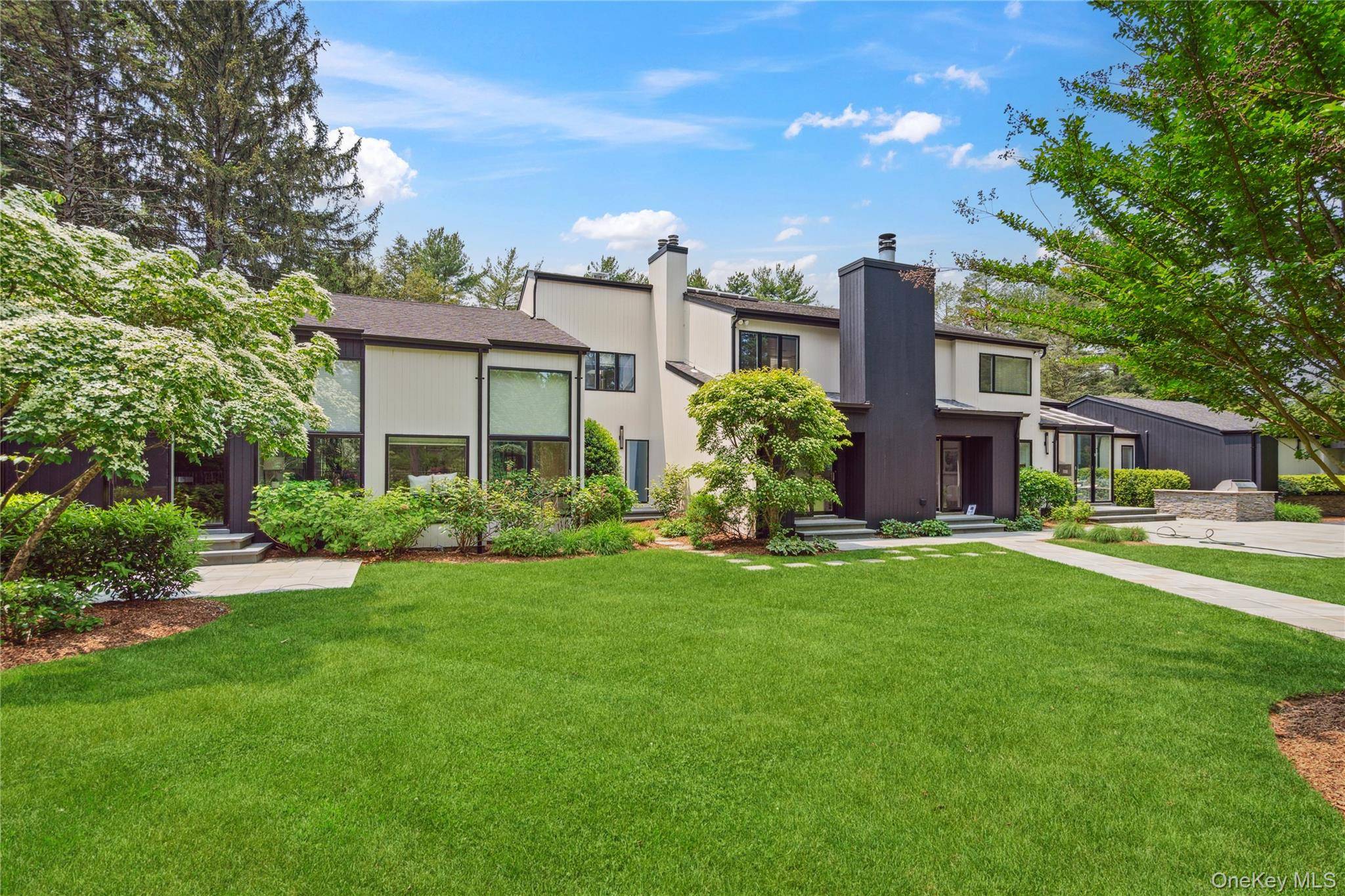 A stunning example of a custom designed home to enhance daily life with an open concept floor plan of primary living spaces and truly magazine worthy.