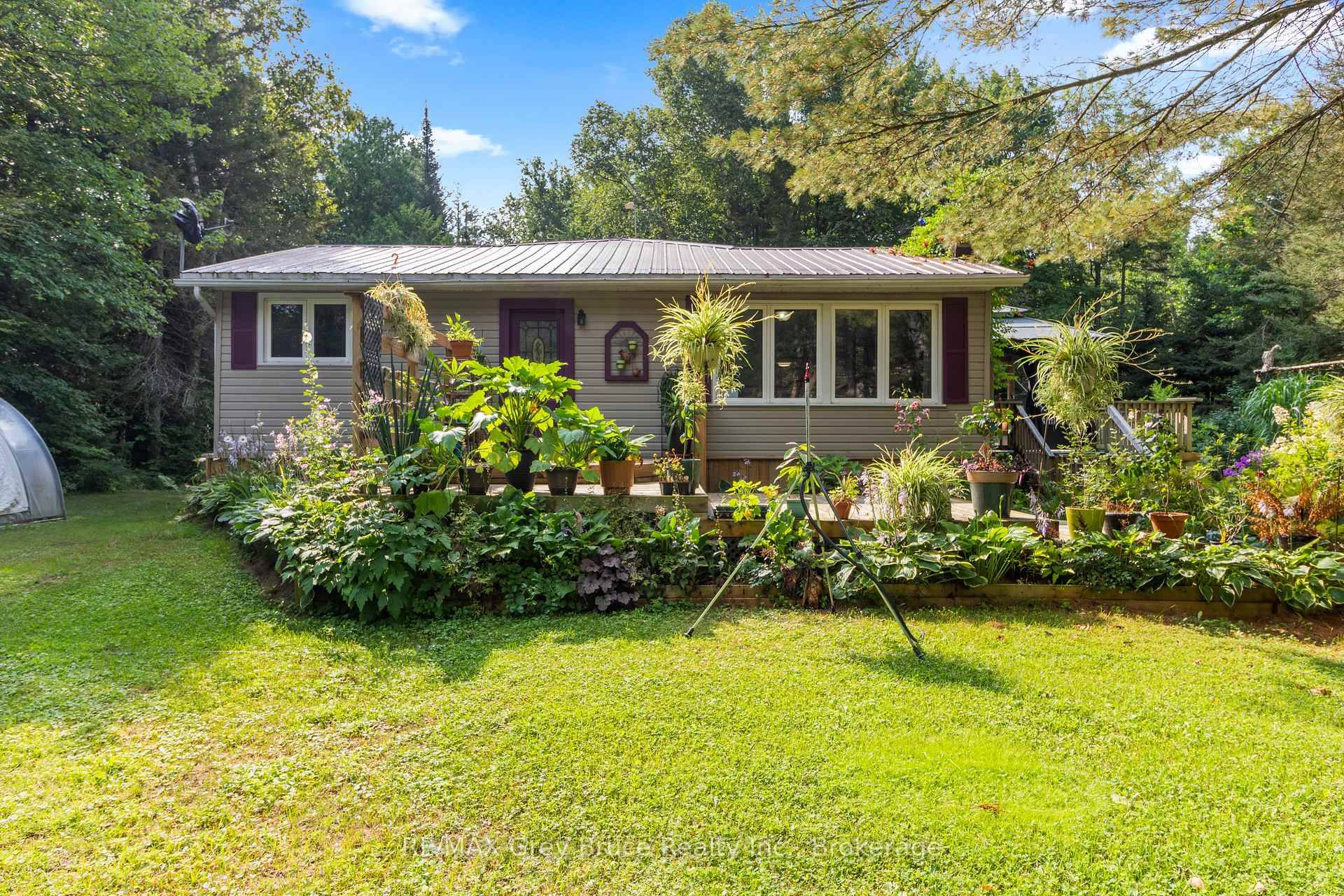PARADISE FOUND ! Welcome to your private retreat nestled on a serene 2 acre lot at the end of a quiet dead end road.