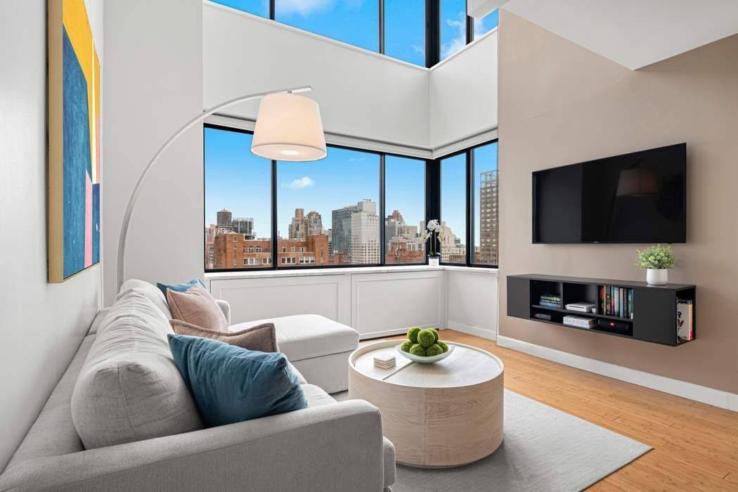 Corner Duplex with Sweeping City amp ; River Views Exceptional Value on the Upper East Side Residence 2103 at The Paladin Condominium is a sun flooded 1 bedroom, 1.