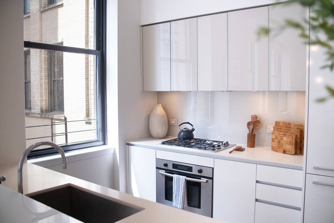 Luxurious Two Bedroom Two Bath Powder Room Condo Experience urban elegance at The Broad Exchange Building.