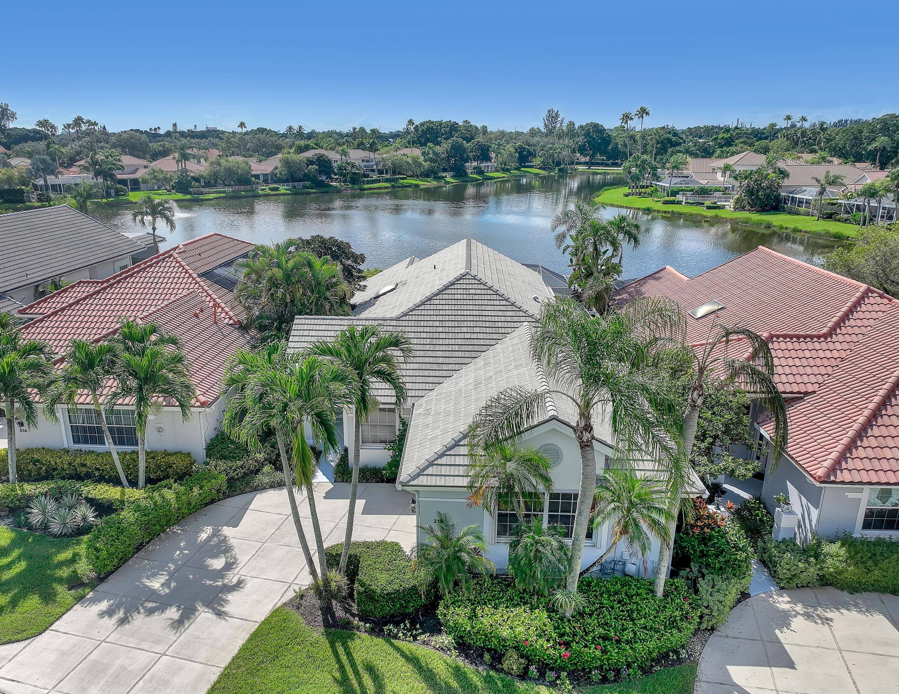 NESTLED IN THE EXCLUSIVE 24 7 DOUBLE GATED PRIVATE COMMUNITY OF EAGLETON LAKES AT PGA NATIONAL.