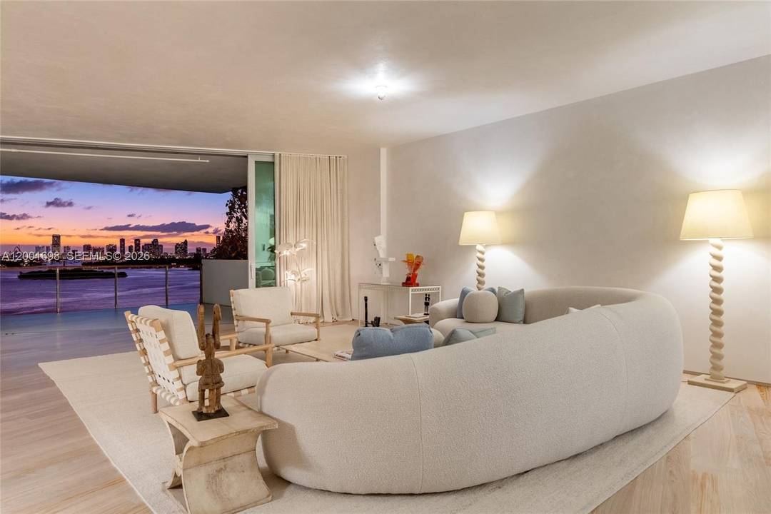A striking bayfront residence defined by architectural significance, refined interiors, and breathtaking sunset views across the Miami skyline.