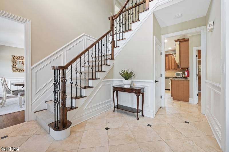 Welcome to this immaculate stone front colonial with beautiful, custom features throughout.