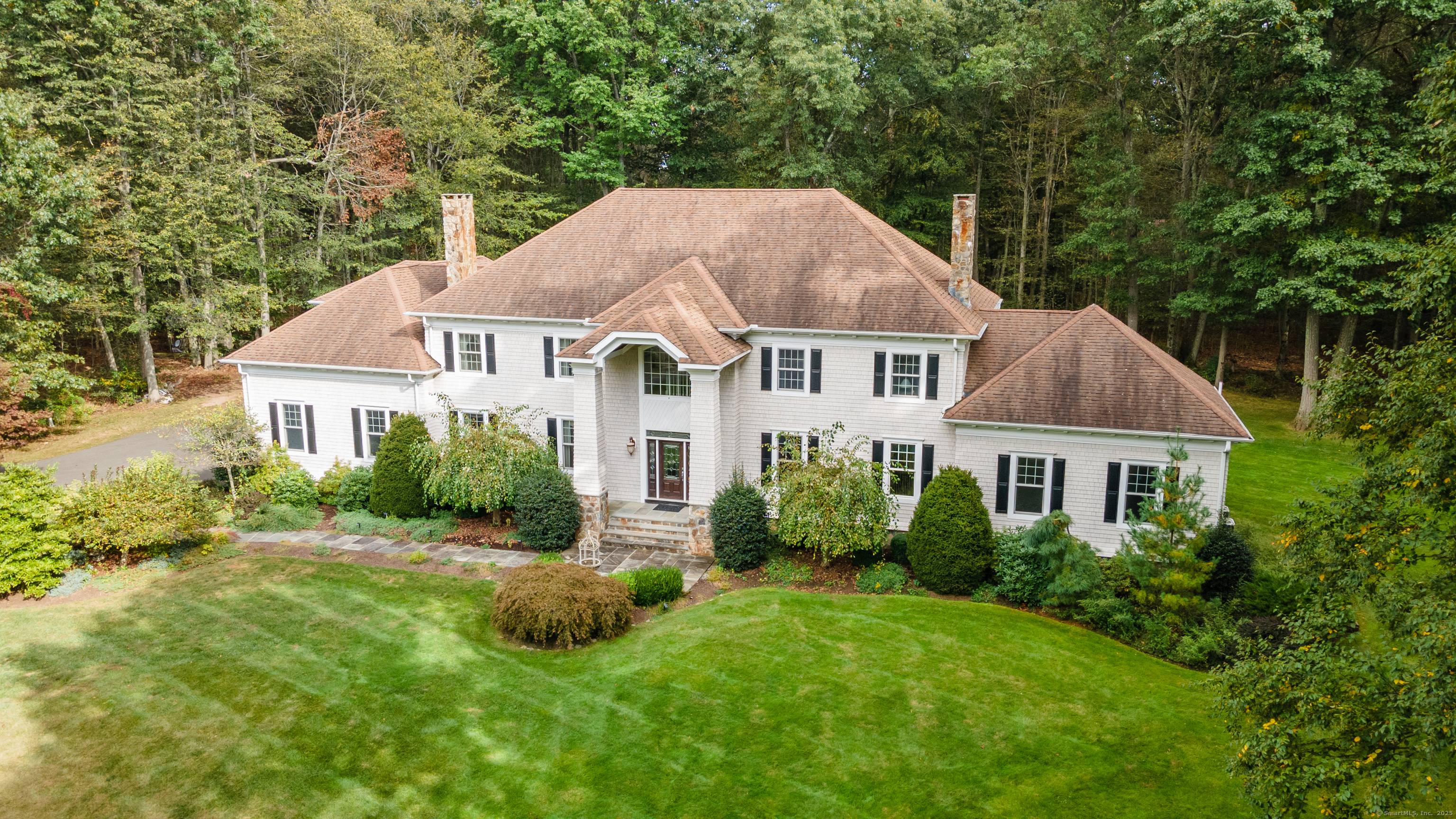Tucked away at the end of a serene cul de sac, this elegant 4BR, 6BA Colonial offers a perfect blend of timeless charm and modern comfort.