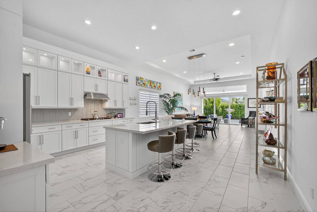 Welcome to the extended McKenna, a beautifully designed Coastal home that captures the relaxed elegance of Florida living.