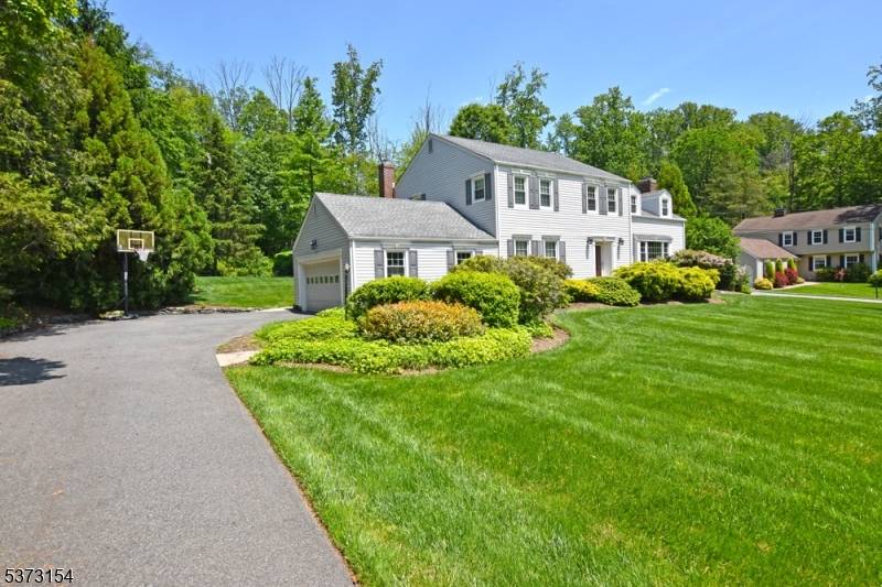 This beautifully updated Colonial blends timeless character with modern amenities and serene natural surroundings.