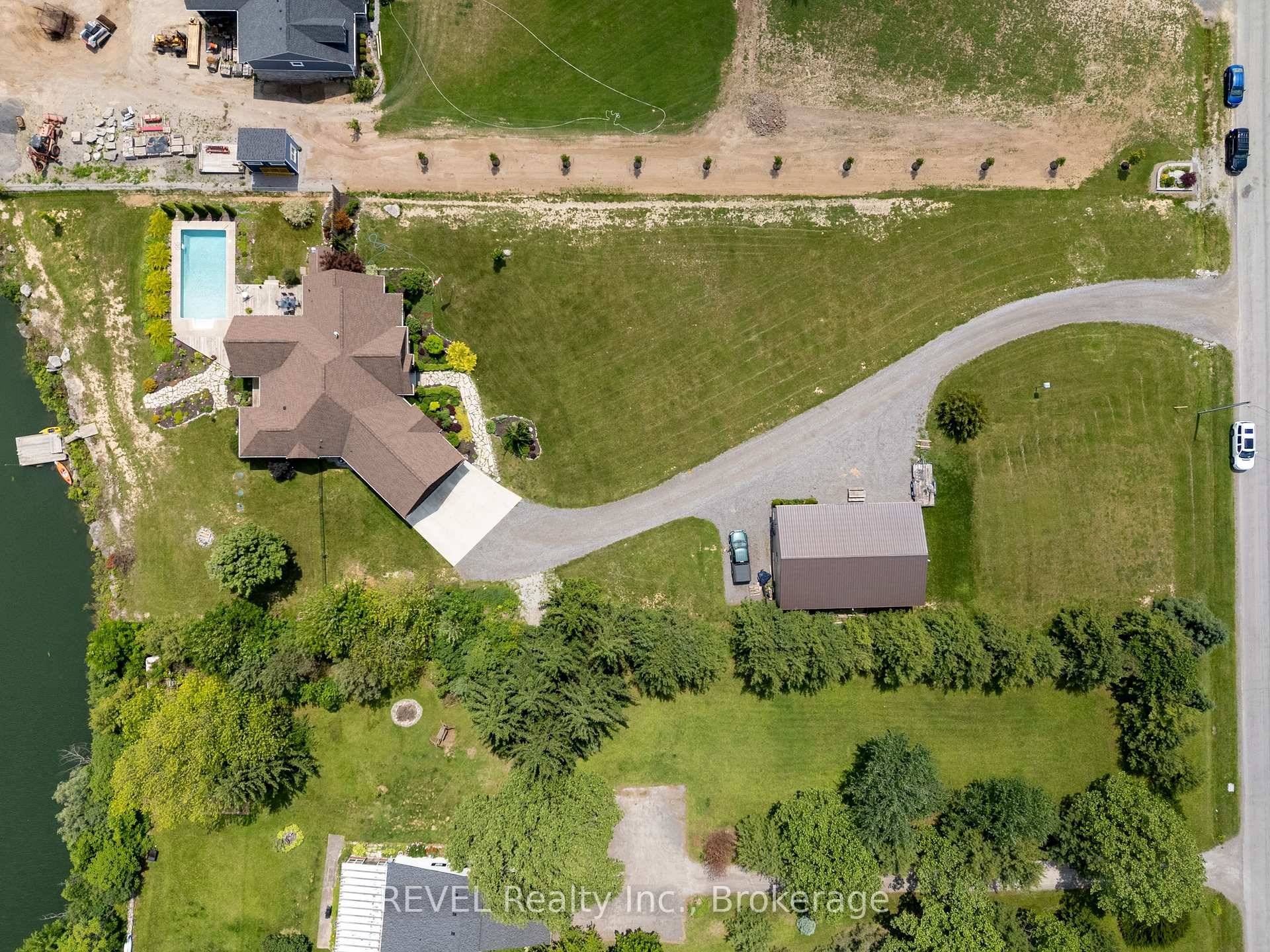 Located just outside the City of Port Colborne with sweeping Wainfleet views, this beautifully appointed bungalow backs onto the serene Port Colborne Quarry Pond and includes.