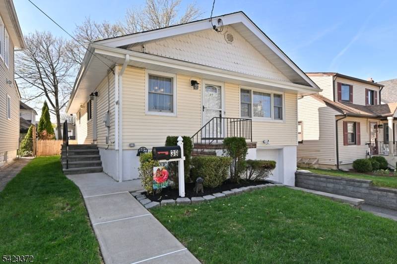 Move in condition 3 BR Ranch with a 2 car tandem garage beautiful oversized yard !