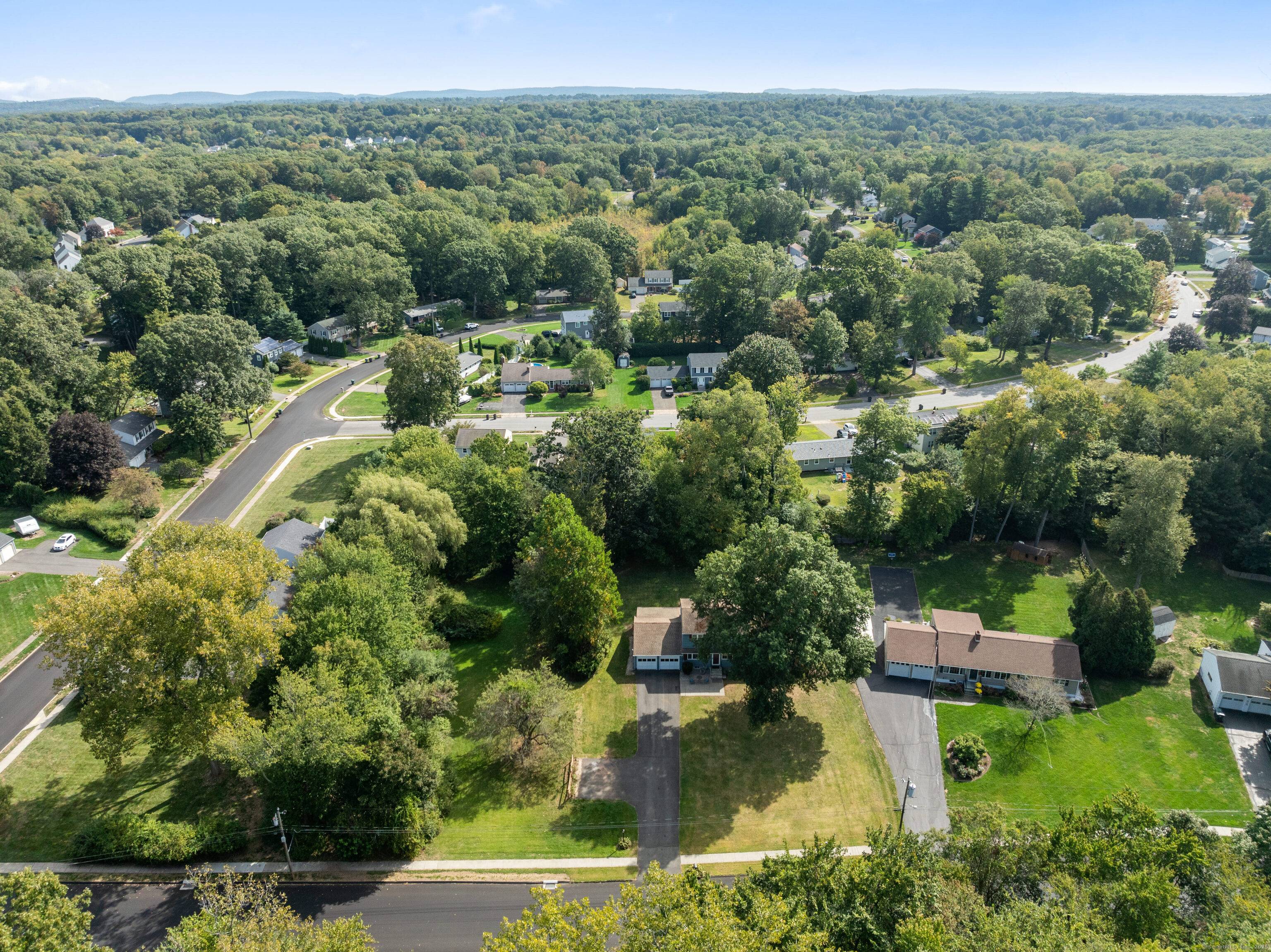 This 5 Bedroom Colonial style home sits on a double lot 0.